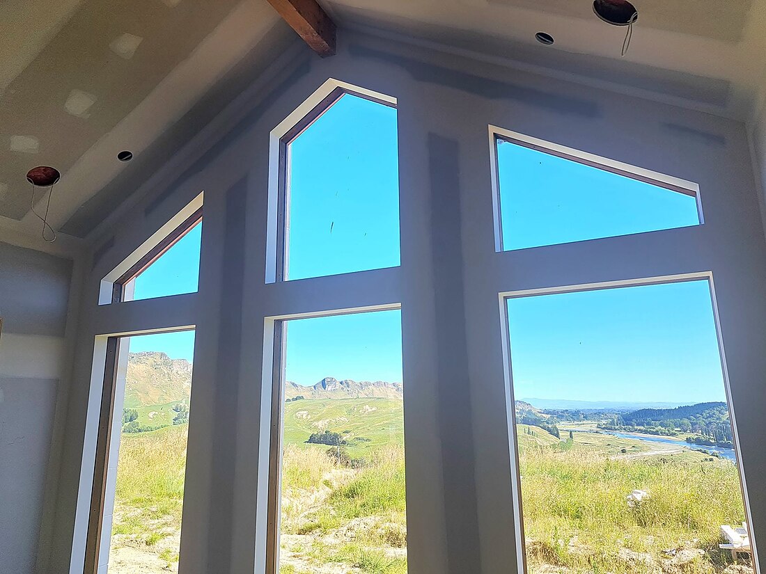 Gable window plaster lining in a new-build home overlooking Hawke's Bay farmland