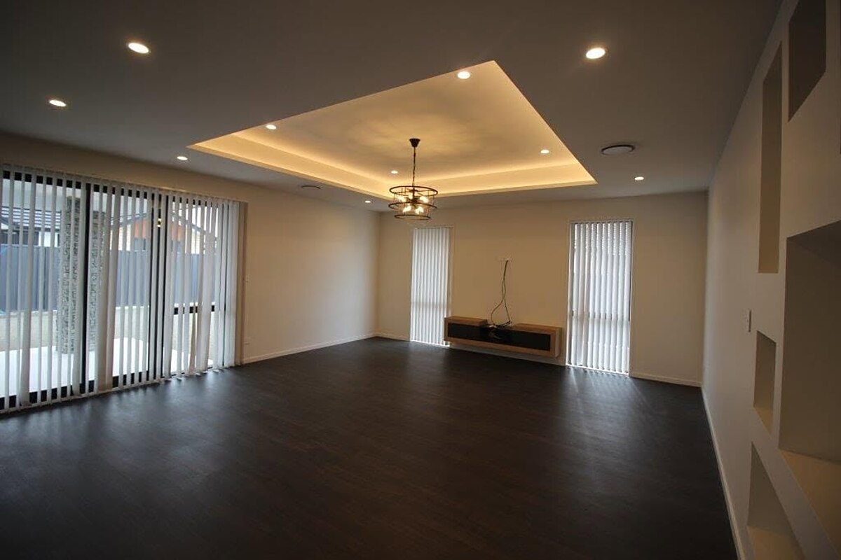 Recessed tray ceiling with feature lighting in a residential living room